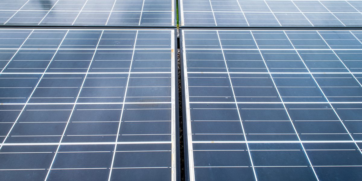 Close-up of solar cells with light dust and spots on the panel surface